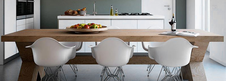 White Eames Armchairs with Metal Legs at Wooden Table