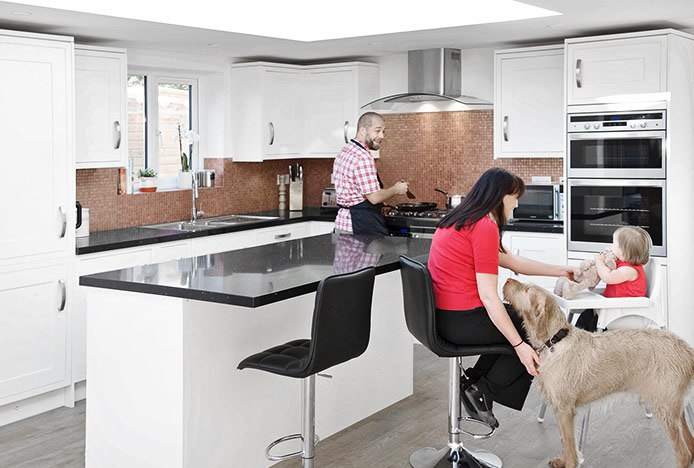 Family And Dog In Kitchen