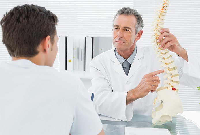 Osteopath with Spine Model