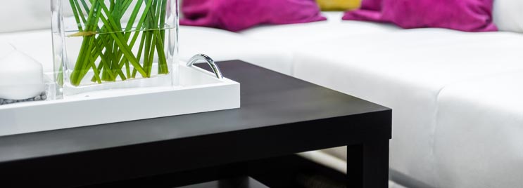 Black Wood Coffee Table with White Sofa